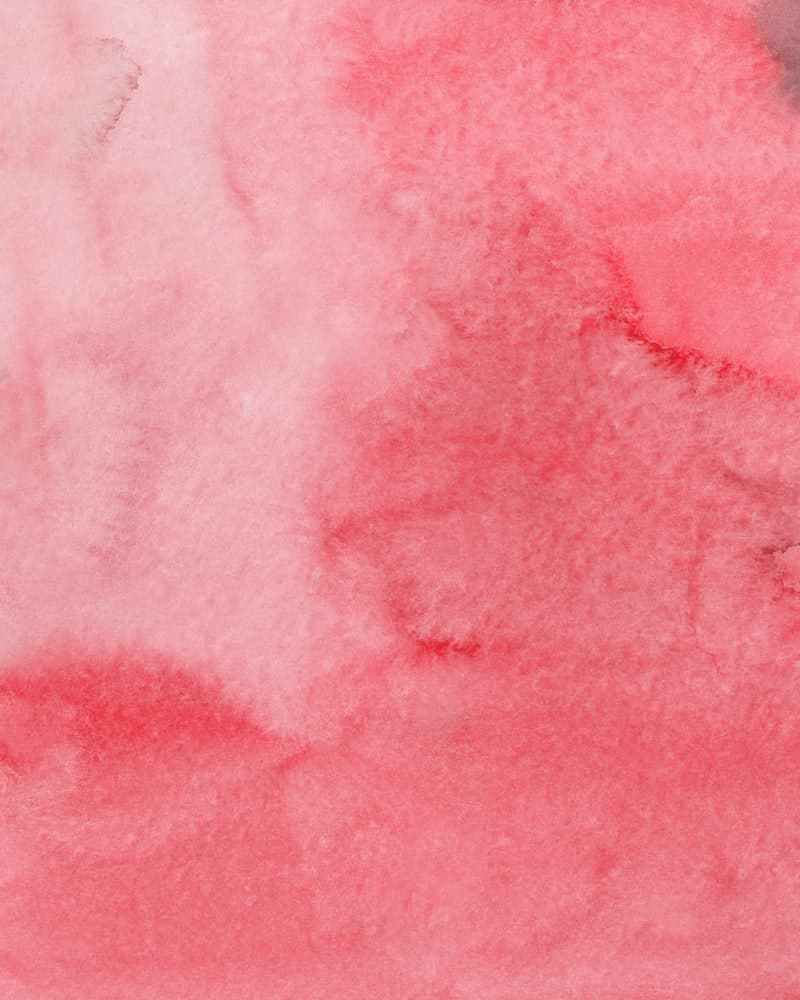 Red fountain pen ink written out on a swatch card.