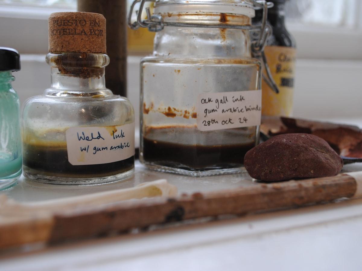 Hand-labelled jars of ink on a windowsill.